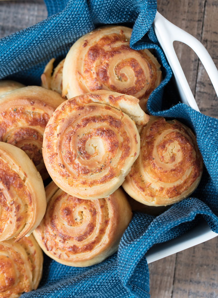 Soft bread dough made from scratch is stuffed with ooey gooey cheese and savory spices to create these delicious homemade cheese rolls. Pair with a bowl of hearty soup and you've got the perfect comfort food meal.