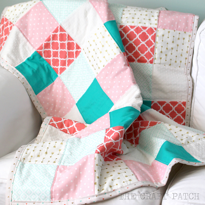 A simple quilt with a modern color scheme and trendy fabric