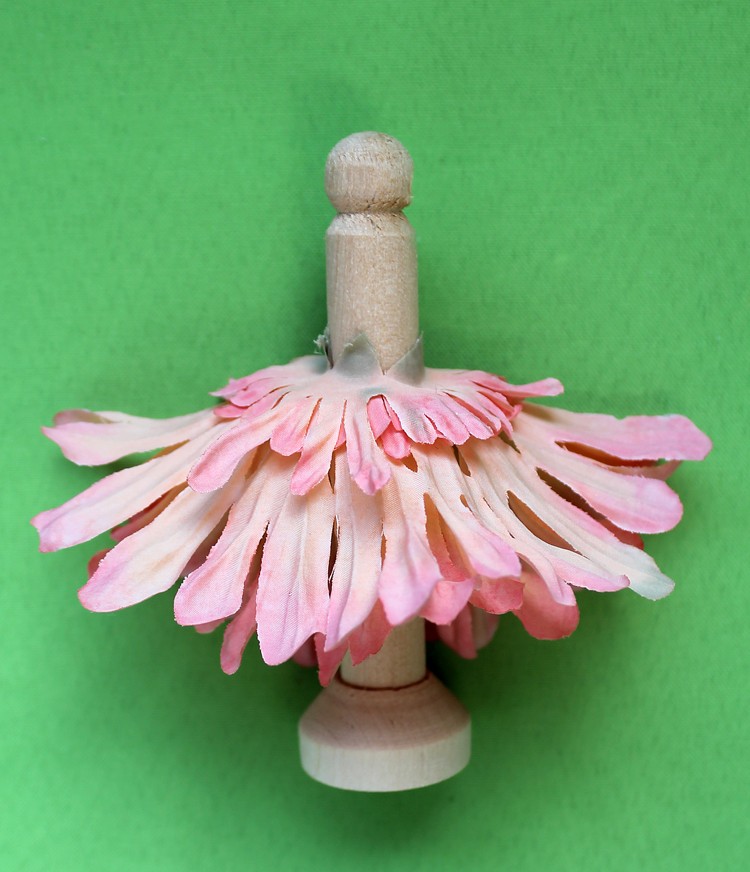 Add a daisy flower skirt to a wooden doll peg