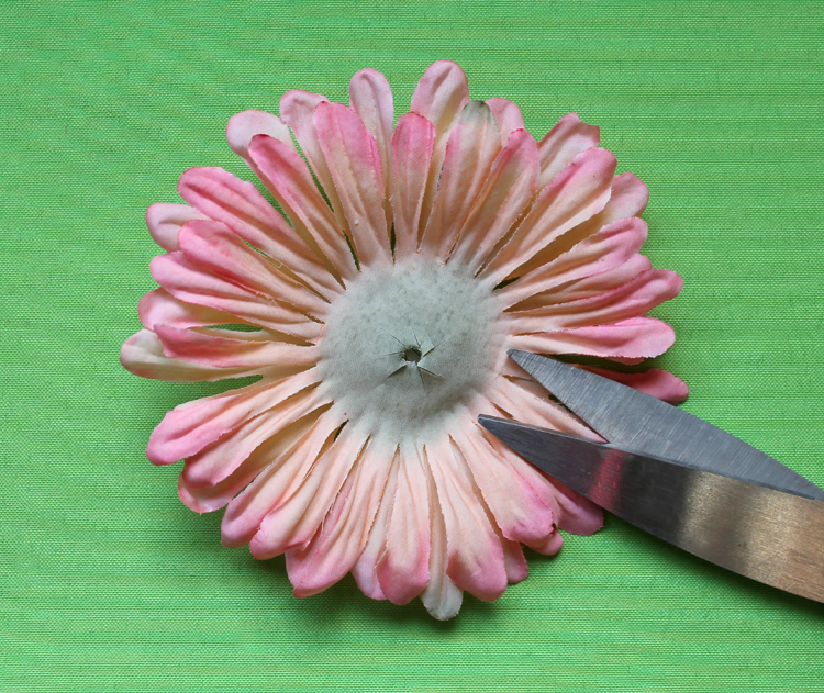 Cut the center of the faux flower.