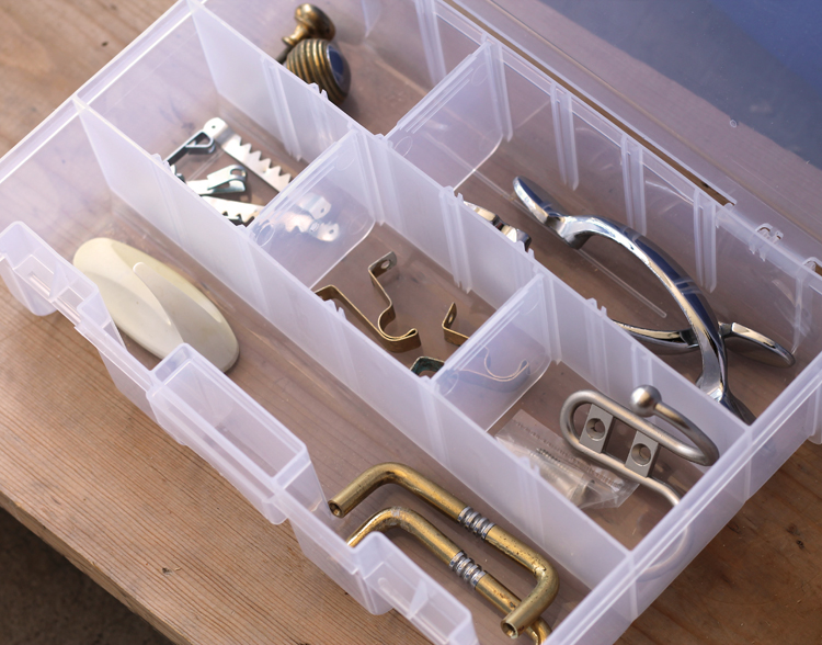 Use a plastic craft storage box to sort hardware.