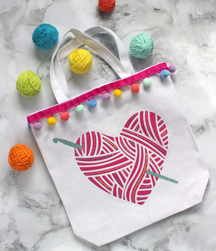 Make a custom yarn bag by combining HTV and hand embroidering