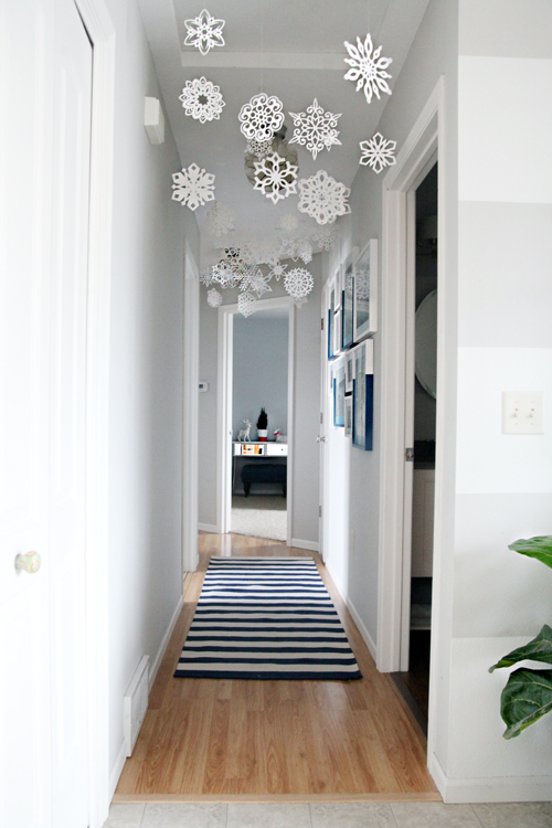 paper snowflakes hanging from ceiling