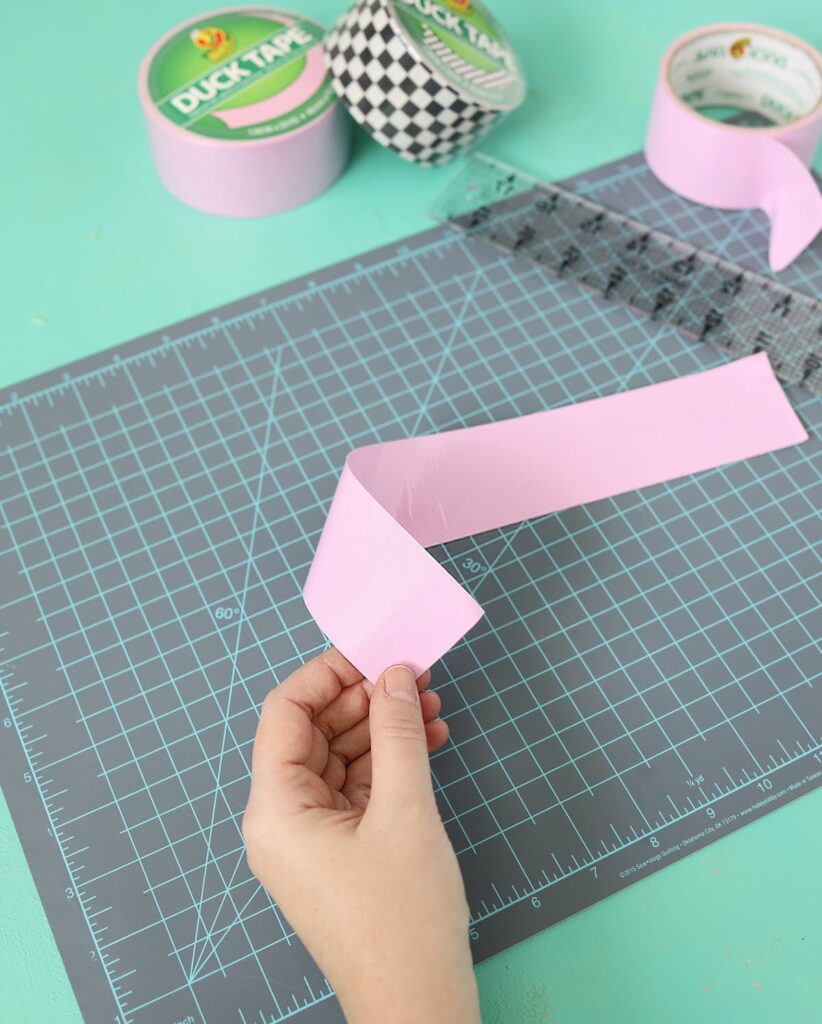 cutting strips of duck tape with a rotary cutter