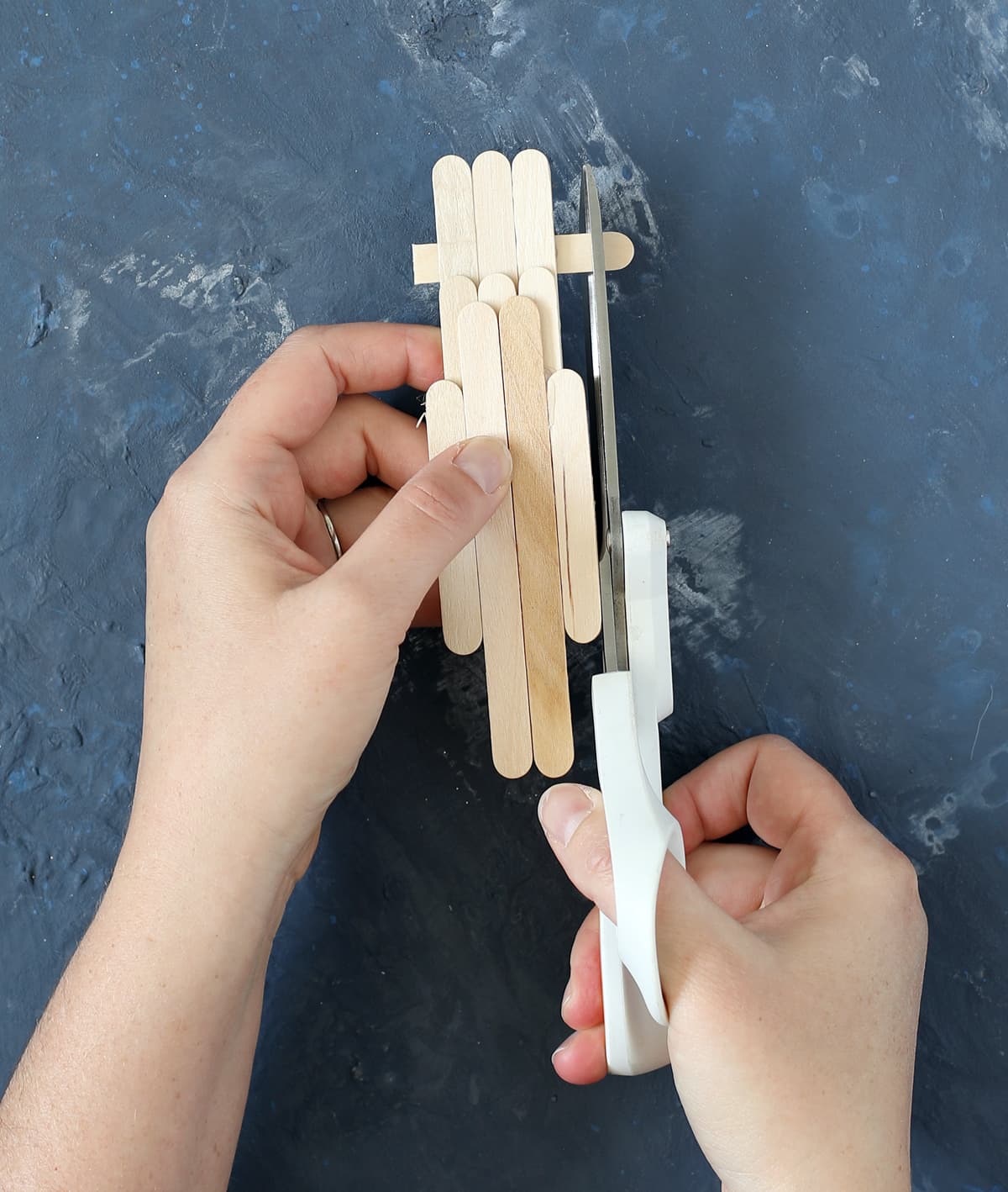 cut craft sticks with scissors